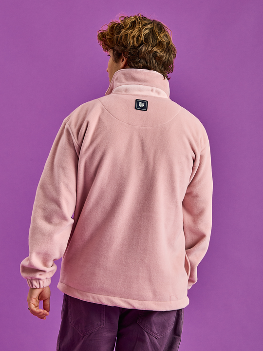 Back shot of the Elsa Fleece in Dusty Pink, this show the design on the back neck and the branded navy patch on the yoke of the fleece.