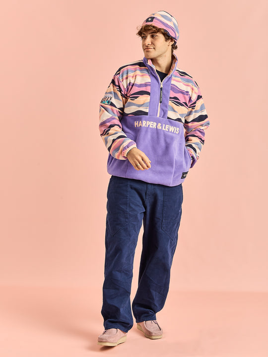 Male Model wearing the Unisex fleece, with new patches on the fleece and the back neck collar.