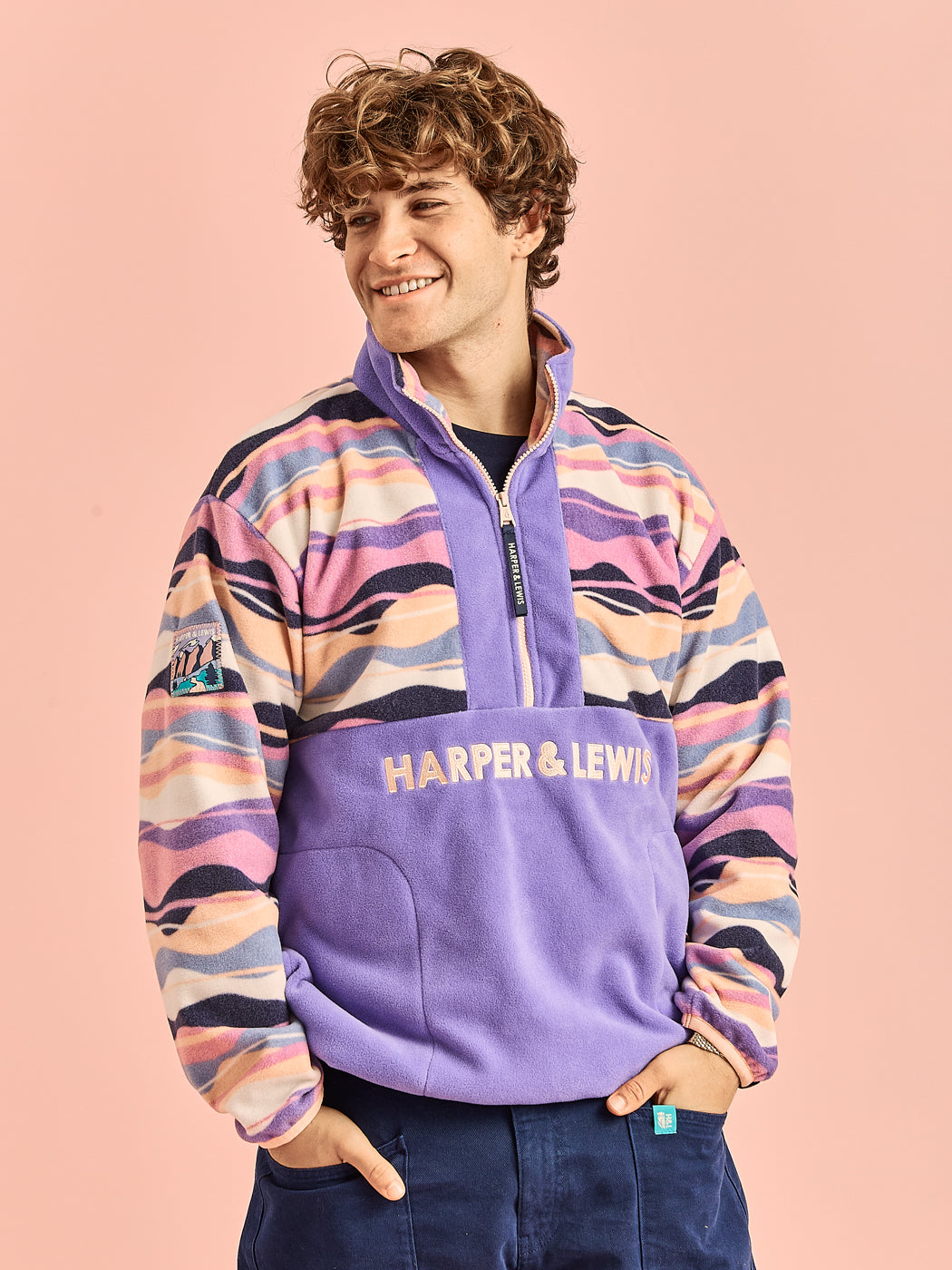 Male model wearing the patterned fleece jacket in our new standard fit.