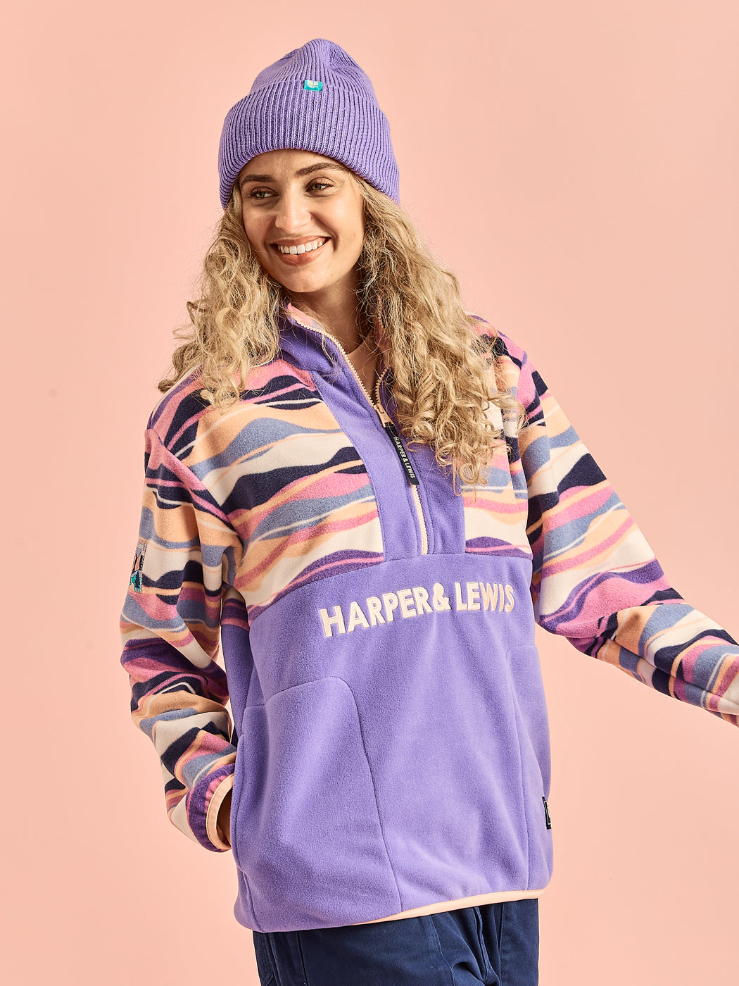 Female model wearing the colourful colour block fleece.