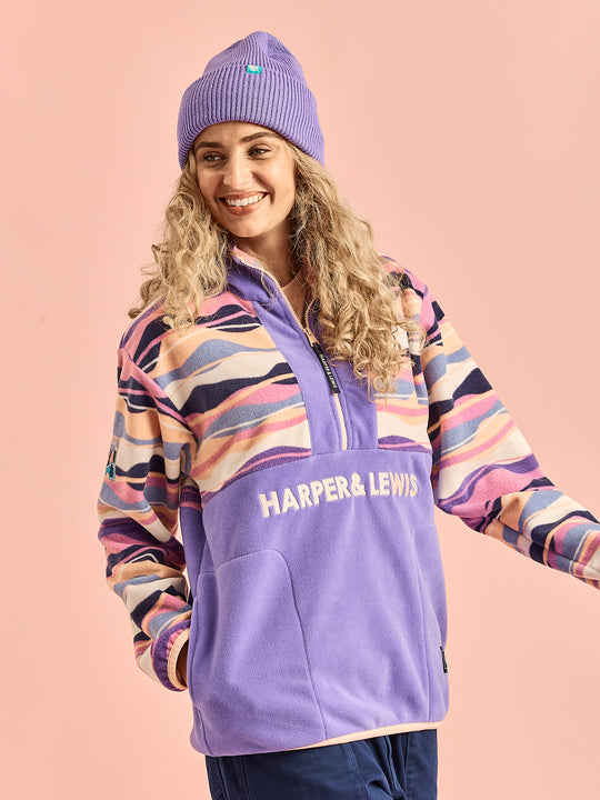 Female model wearing the colourful colour block fleece.