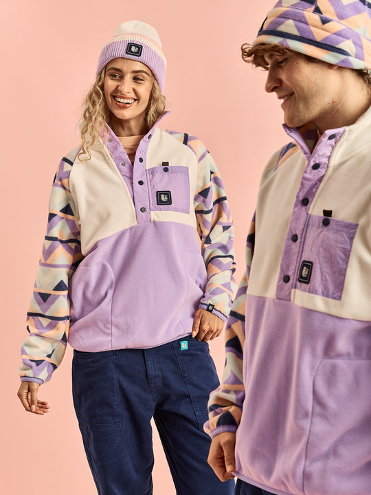 Both models wearing the Sutton Popper Neck Fleece in Cream & Lavender with an aztec pattern.
