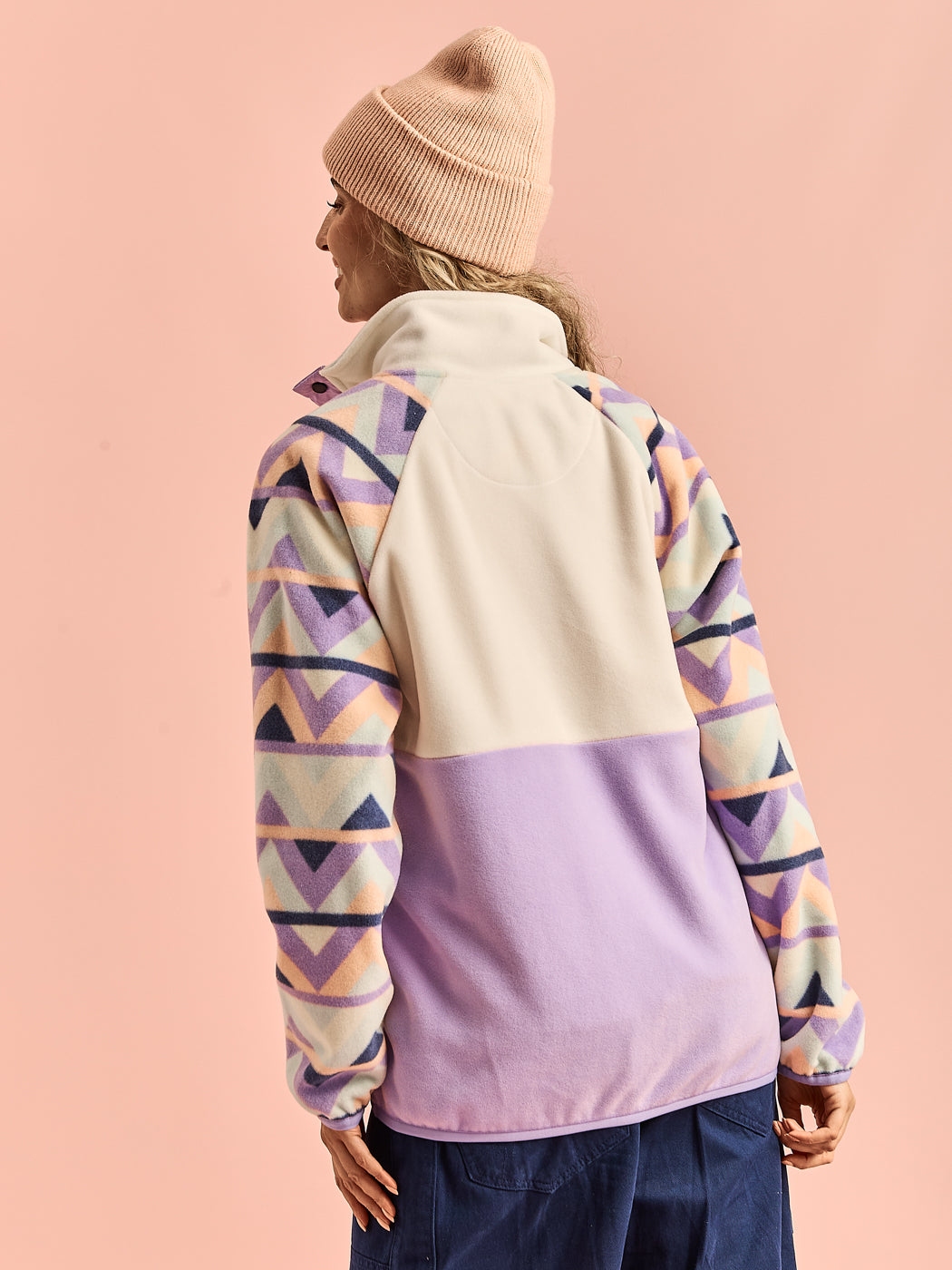 Back view of the Sutton fleece on model, showing full coverage of retro-inspired pattern and cozy fleece texture.