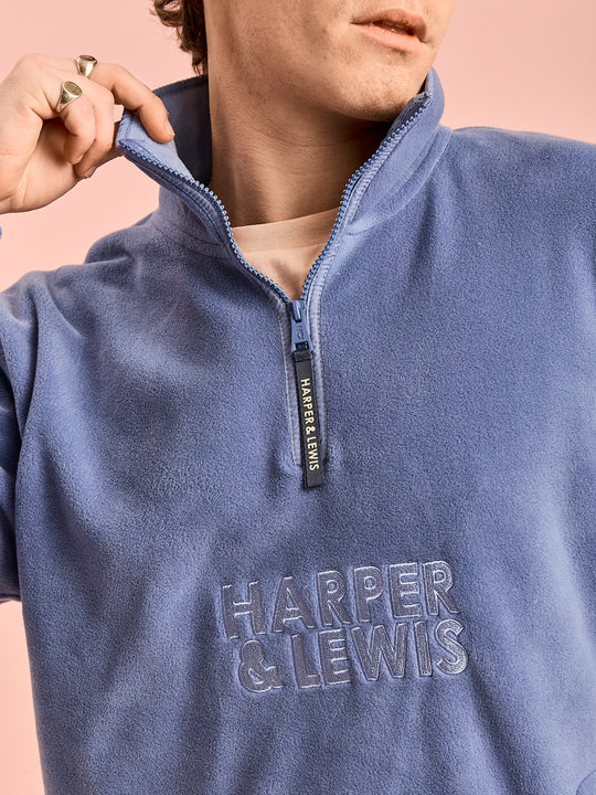 Detail shot of the embroidered 'Harper & Lewis' logo and the navy branded zip puller.