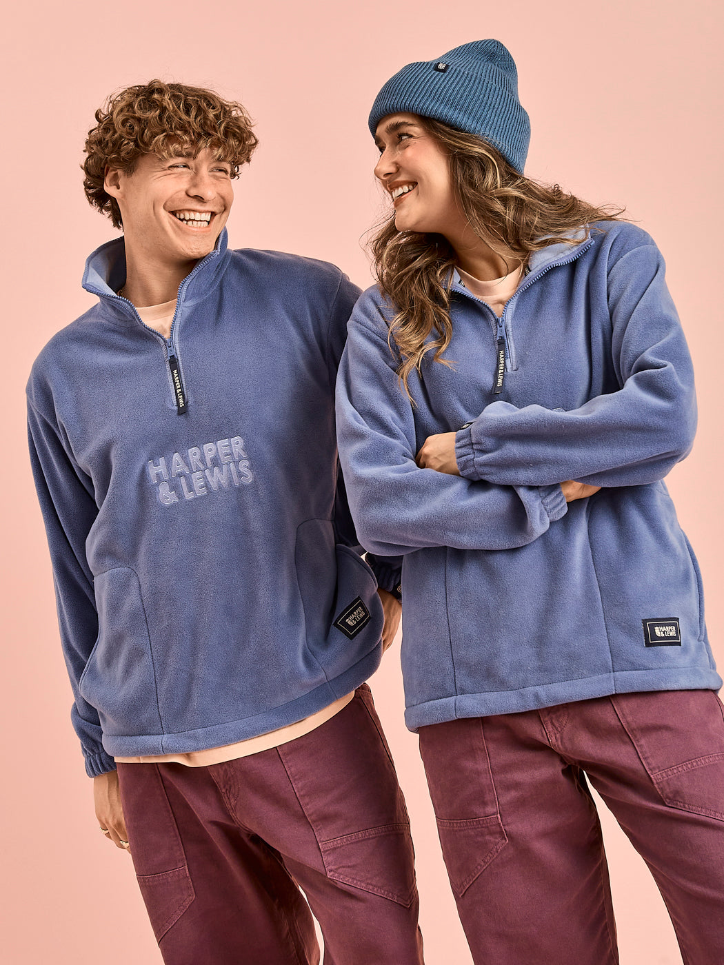 Both Models wear the Elsa quarter zip unisex fleece in Airforce Blue.