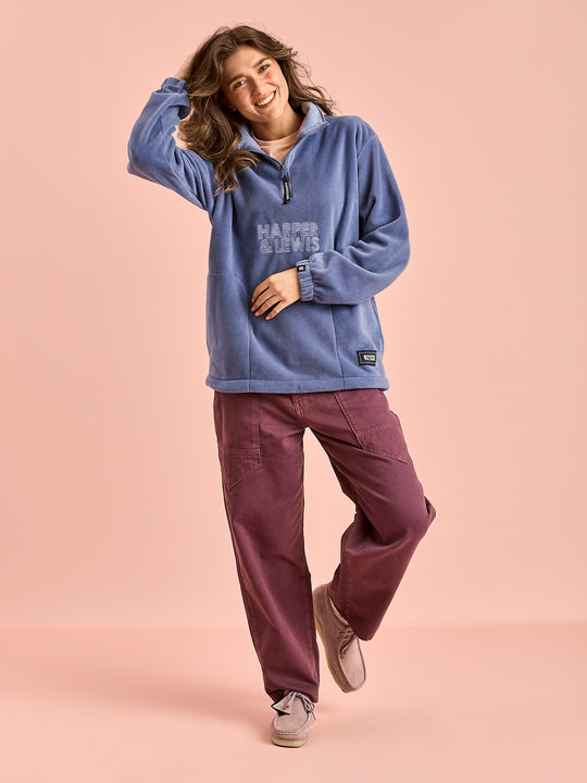 Female Model wears the Elsa Fleece in Airforce.