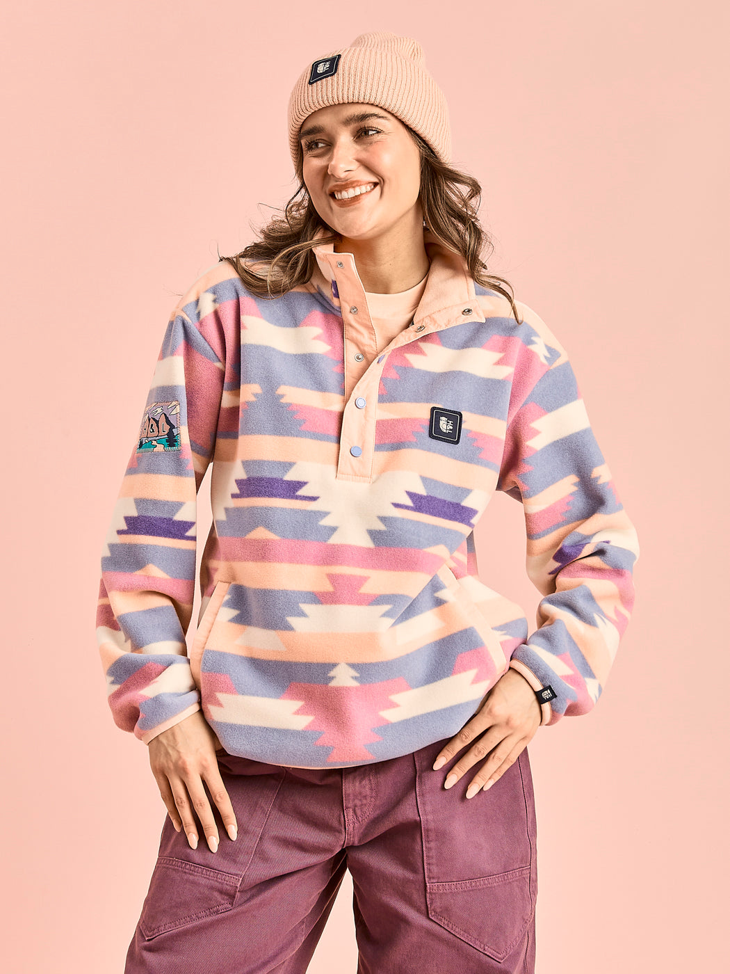 Female Model wears the Tallow fleece in Tribal Pattern in Peach