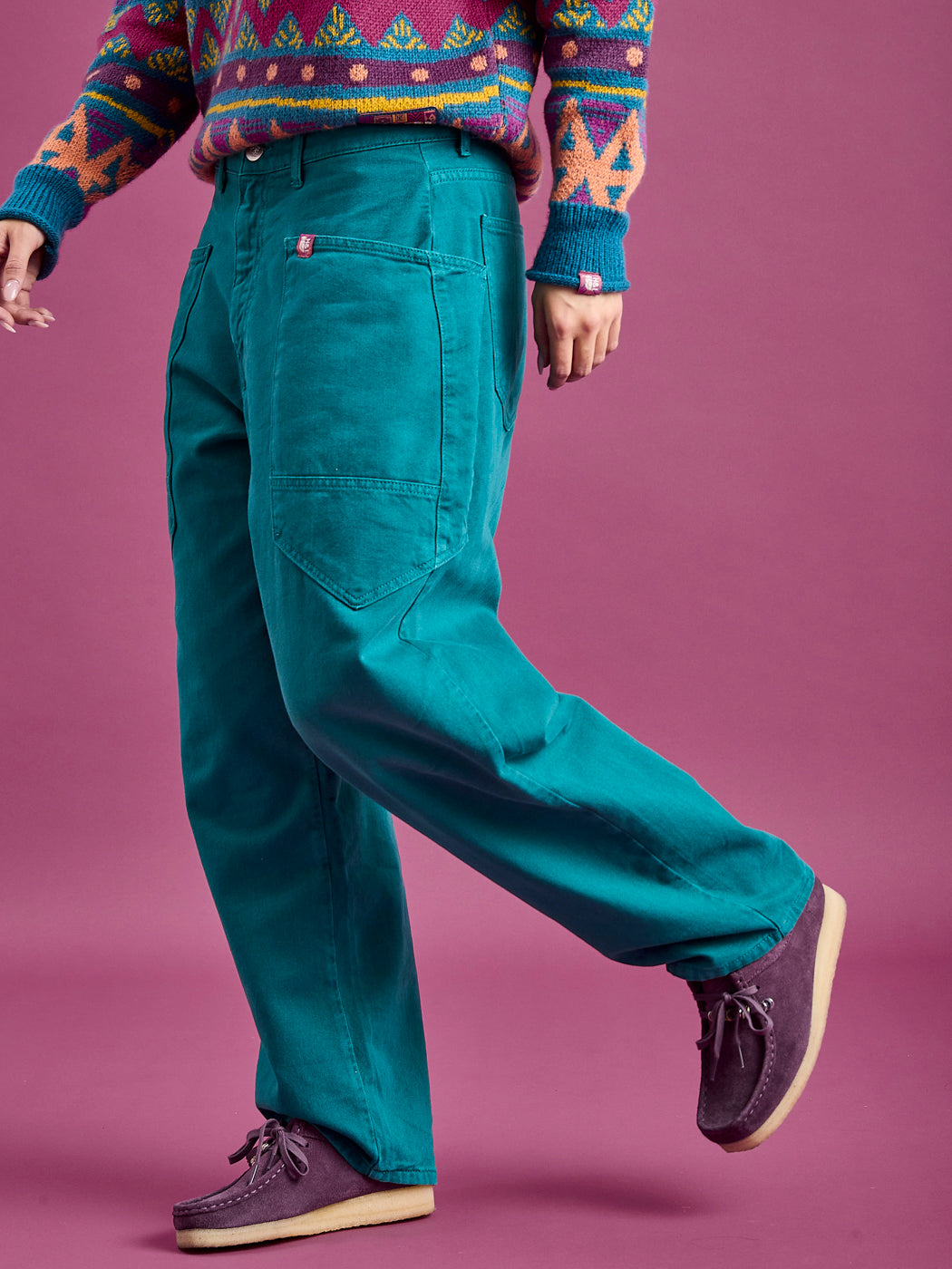 These workwear style trousers feature wrap around front pockets with a small tab branded badge