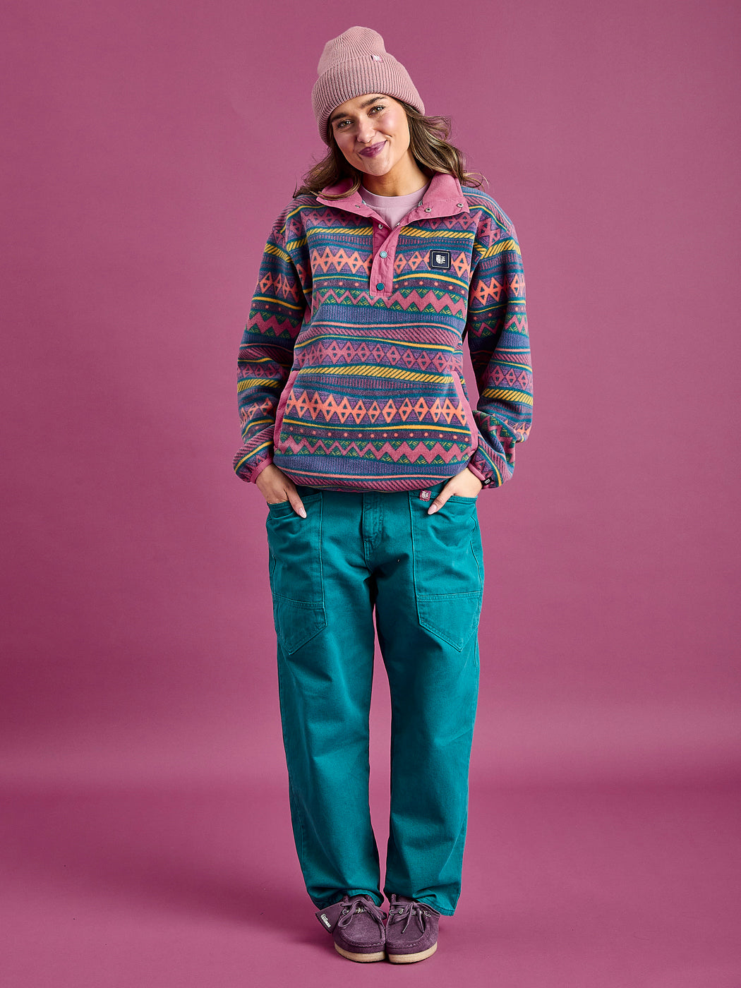 Female Model wears the aztec unisex fleece with contrasting dark rose plackets