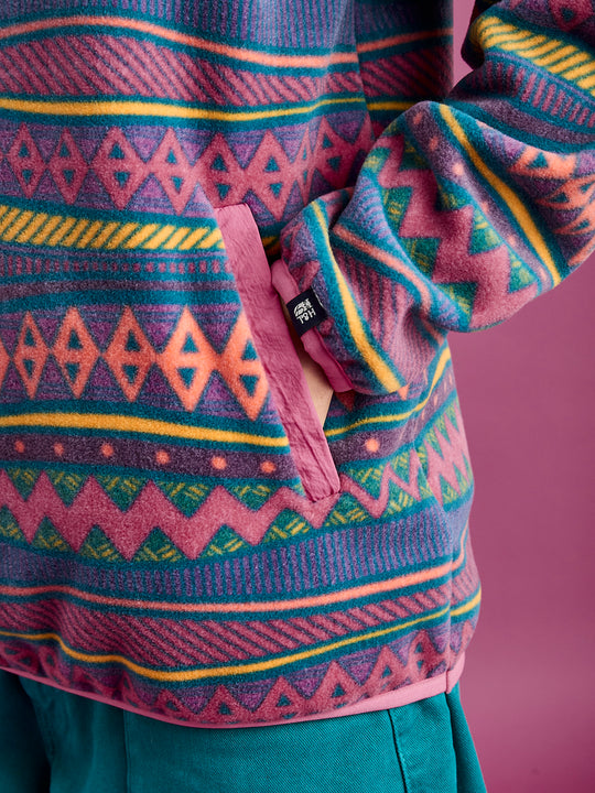 Detail shot of the side entry pockets which is in dark rose with the binding on the cuffs and hem in this colour also