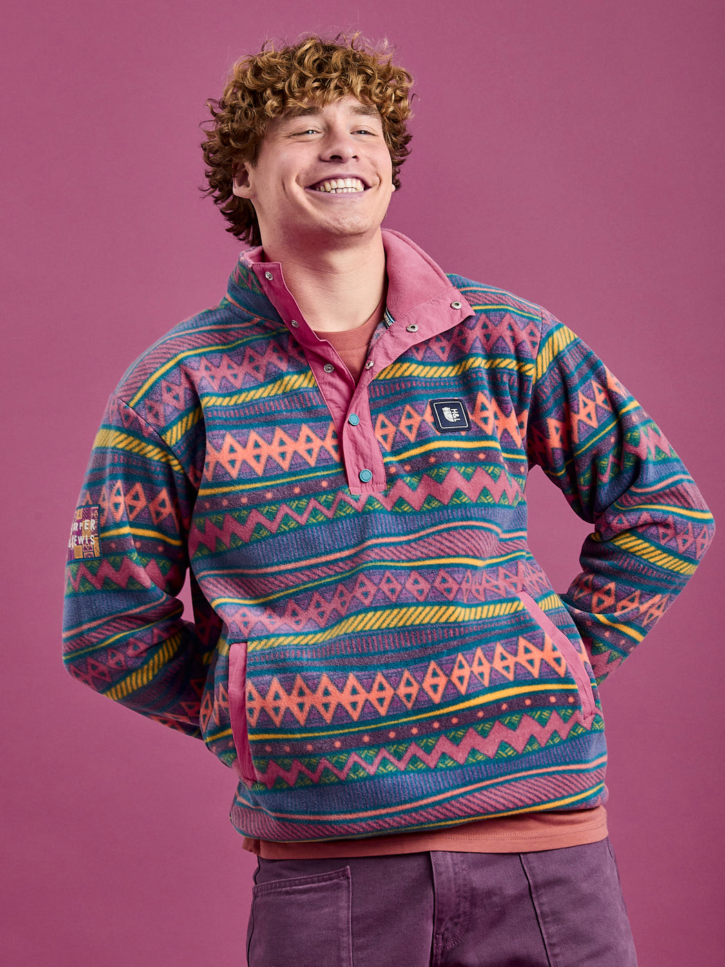 Male model wears the patterned fleece jacket which is made from a 100% polyester polar fleece