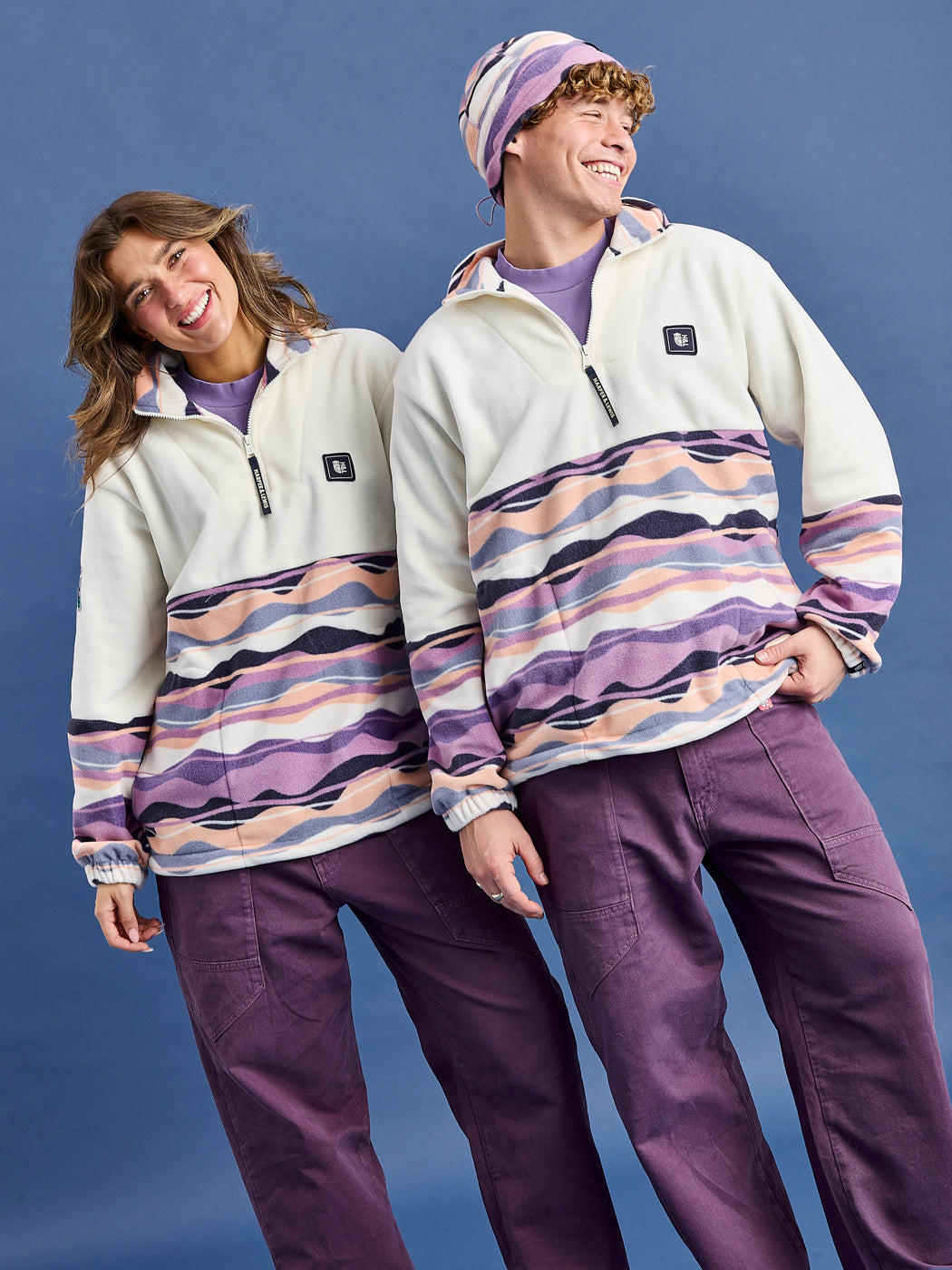 The print on this oversized fleece features colours of Light Peach, Pale Airforce, Deep Lavender, Lavender Mist, Navy & Cream.