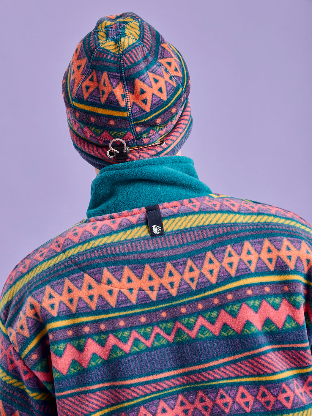 Detailed image of the new back neck designed for hanging the fleece jacket.