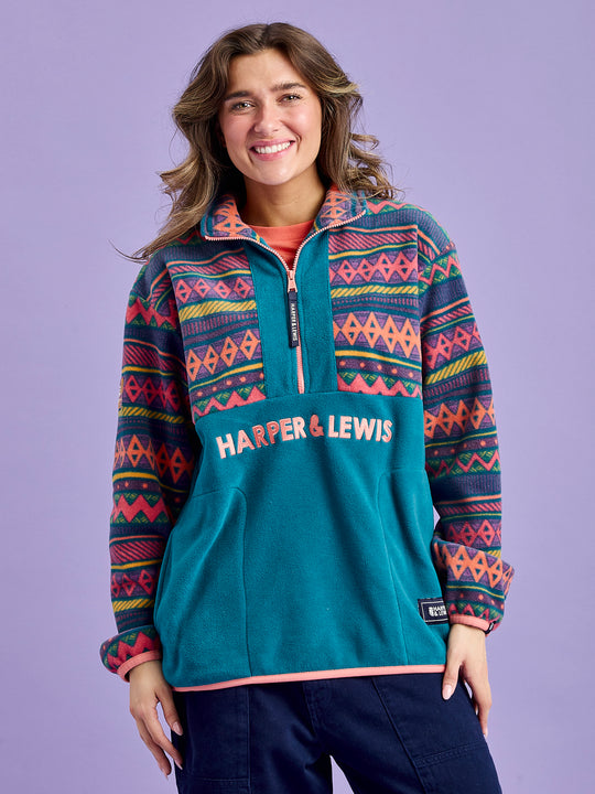 Women in the latest Bodie fleece, updated with a new patch on the arm and a new overall colour.