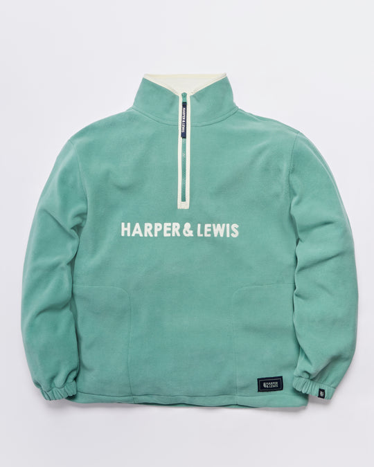 Comfort-fit Harper & Lewis Polar Fleece, with a relaxed silhouette, 1/4 zip collar, and soft fleece texture. Embroidered chest logo adds a refined touch.