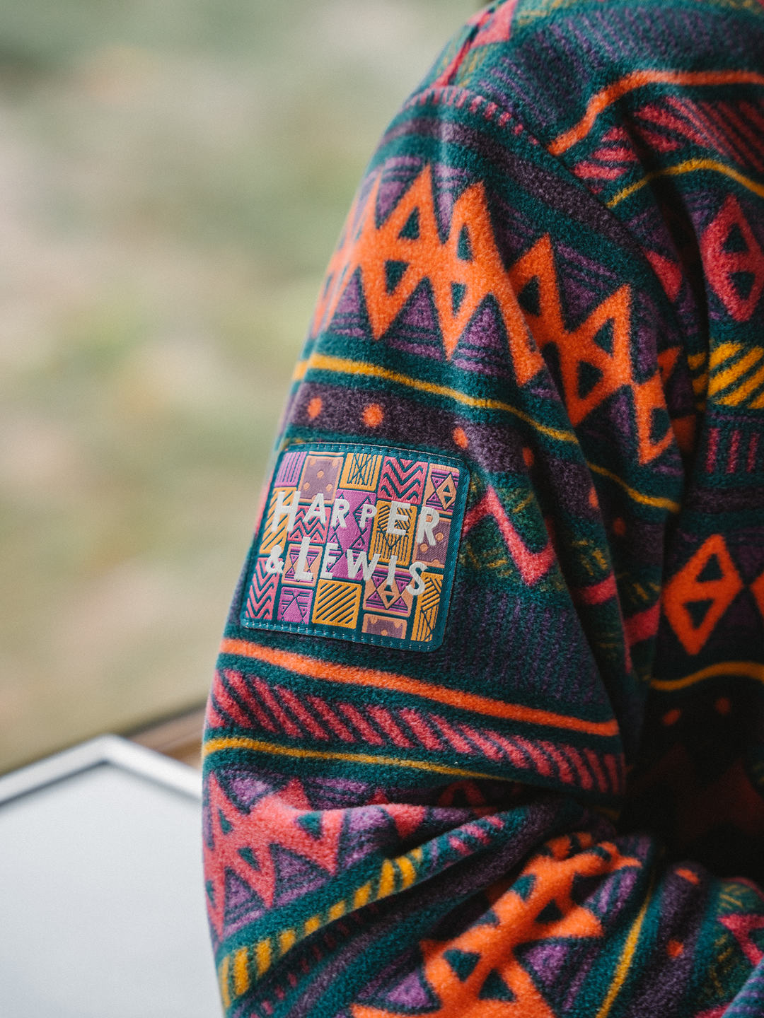 Detail shot of the aztec branded woven badge which is on the right arm