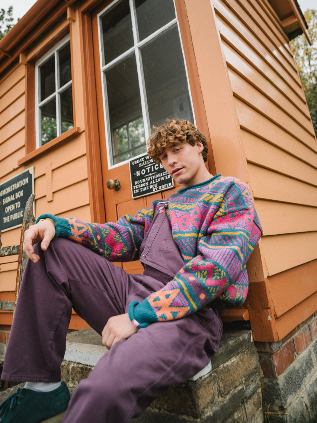 Male model shown wearing the unisex dungarees on an adventure