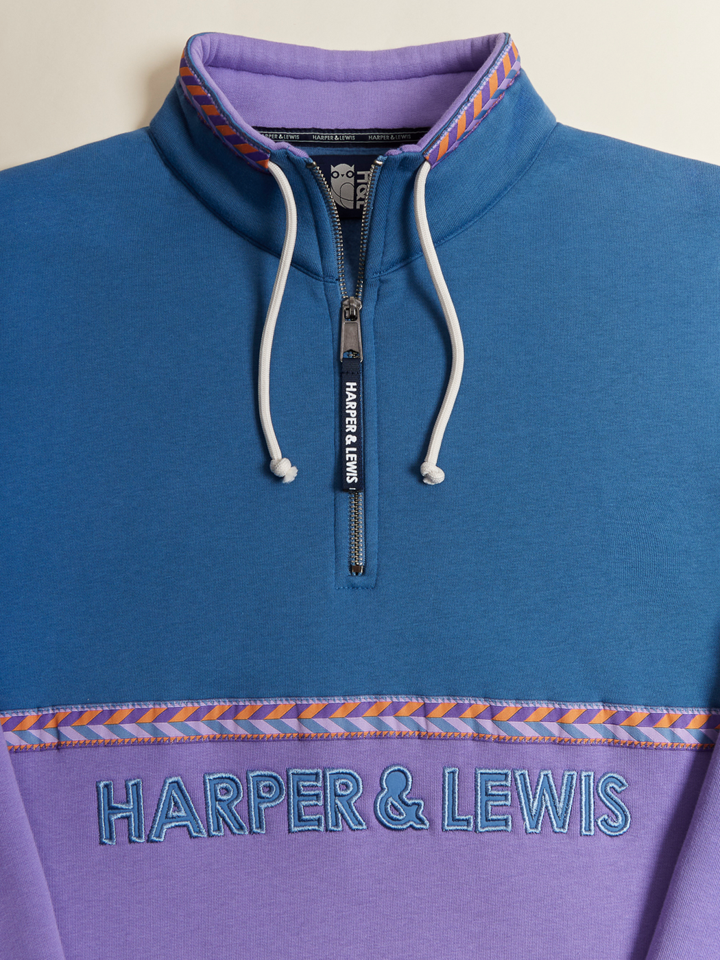 The Kit quarter zip sweater features a Harper & Lewis embroidery across the chest in Petrol.