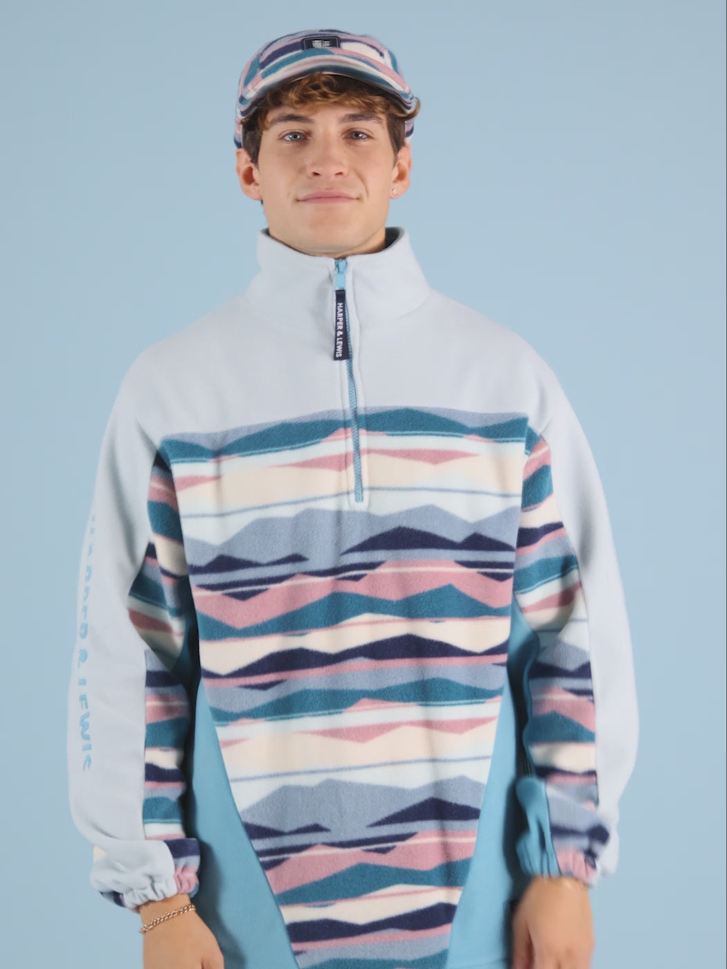 Unisex Quarter Zip Fleece in a Mountain Patterned Print colour block.